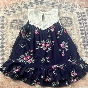 Blue and White Floral Blouse with Ruffled Hem